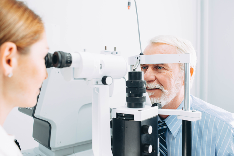 Senior man eye exam
